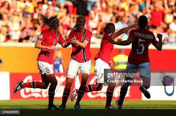 Solveig Gulbrandsen of Norway celebrates with Ingvild Isaksen and Trine Rønning after scoring the opening goal during their UEFA Women's EURO 2013...