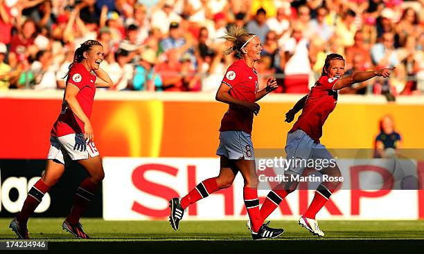 Solveig Gulbrandsen of Norway celebrates with Ingvild Isaksen and Trine Rønning after scoring the opening goal during their UEFA Women's EURO 2013...