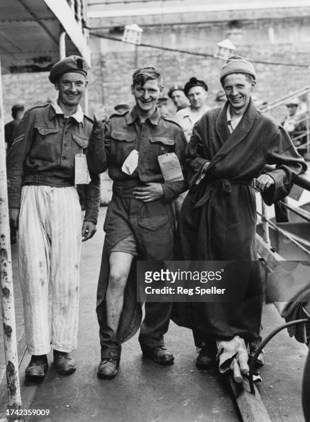 Corporal Curtis, driver Howell and Private Baron, convalescing wounded British 2nd Army soldiers return from the Normandy front during Operation...