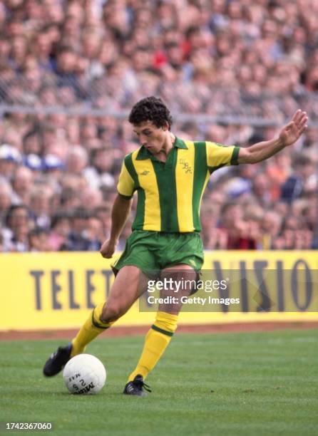 West Bromwich Albion player John Trewick in action in the green and yellow Umbro Albion away kit during a First Divsion match against Brighton and...