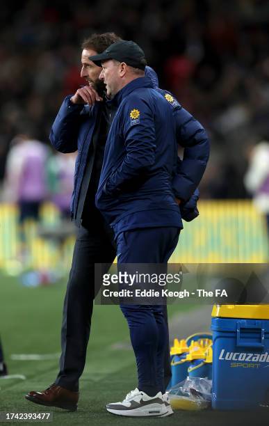 Gareth Southgate talks to Steve Holland, Assistant Manager of England during the UEFA EURO 2024 European qualifier match between England and Italy at...