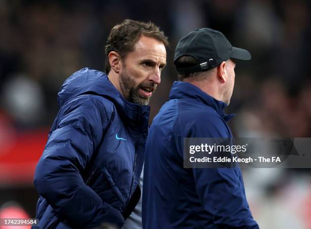 Gareth Southgate talks to Steve Holland, Assistant Manager of England during the UEFA EURO 2024 European qualifier match between England and Italy at...