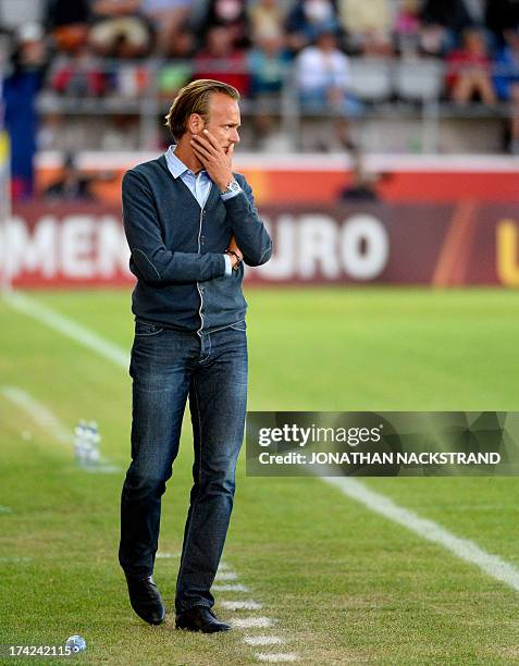 Denmark's head coach Kenneth Heiner-Moller looks on during the UEFA Women's European Championship Euro 2013 quarter final football match France vs...