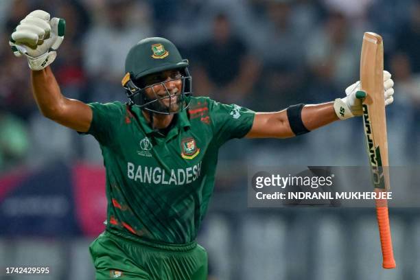 Bangladesh's Mahmudullah celebrates after scoring a century during the 2023 ICC Men's Cricket World Cup one-day international match between South...