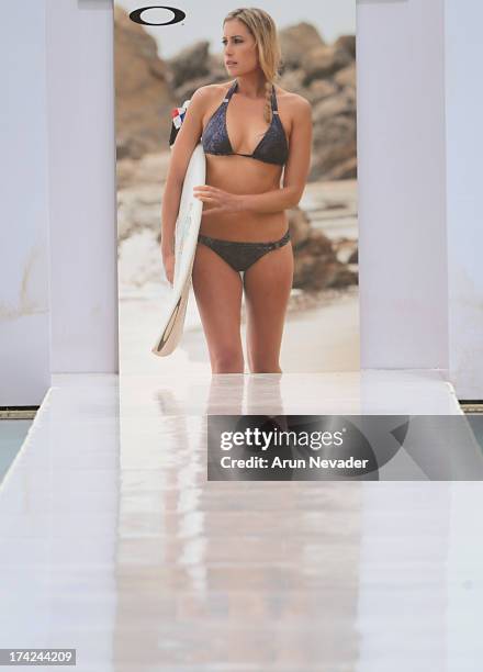 Signage on the runway during the Oakley fashion show at Mercedes-Benz Fashion Week Swim 2014 - Runway at the SLS Hotel on July 21, 2013 in Miami,...