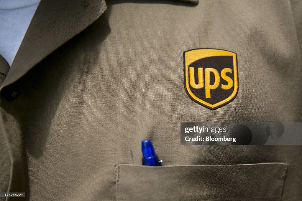 The United Parcel Service Inc. logo is seen on the shirt of employee