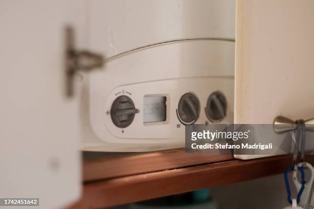 turn on the heating gas boiler in the house, temperature - gas boiler stock pictures, royalty-free photos & images