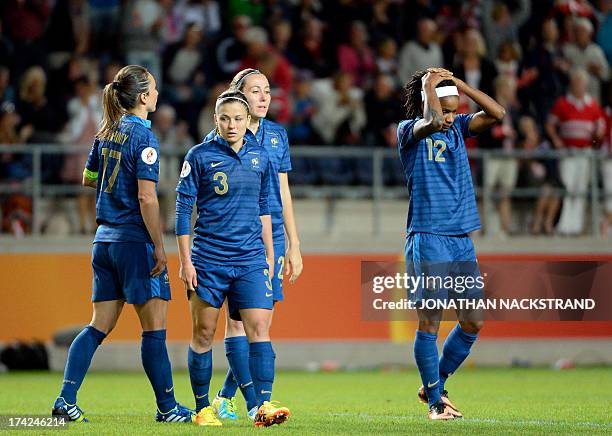 France's players react after losing in the penalty shootout of the UEFA Women's European Championship Euro 2013 quarter final football match France...