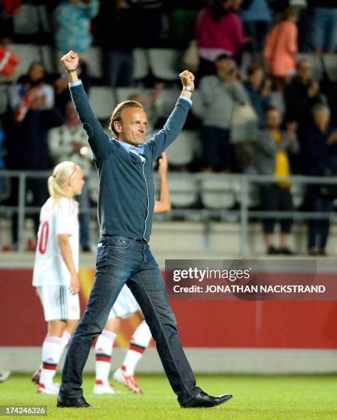 Denmark's head coach Kenneth Heiner-Moller celebrates after winning in the penalty shootout the UEFA Women's European Championship Euro 2013 quarter...