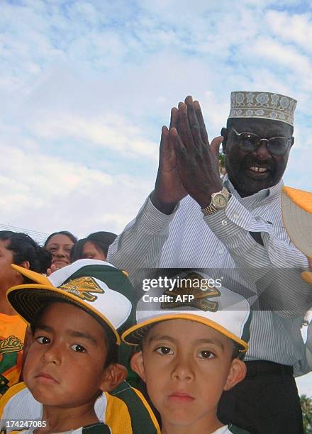 President Barack Obama's half-brother, Malik Obama, takes part in an activity with Mexican children in a school in Nuevo Laredo, Tamaulipas State, on...