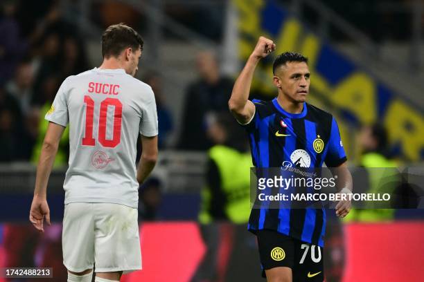 Inter Milan's Chilean forward Alexis Sanchez celebrates after scoring the team's first goal during the UEFA Champions League 1st round day 3 Group D...