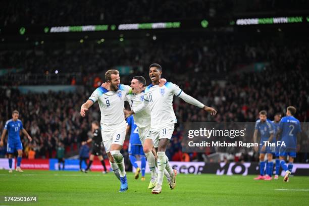 Marcus Rashford of England celebrates scoring to make it 2-1 with team mates Harry Kane and Phil Foden during the UEFA EURO 2024 European qualifier...