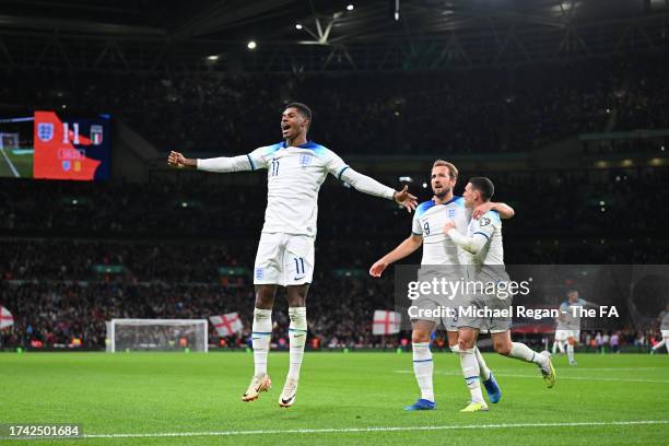 Marcus Rashford of England celebrates scoring to make it 2-1 with team mates Harry Kane and Phil Foden during the UEFA EURO 2024 European qualifier...