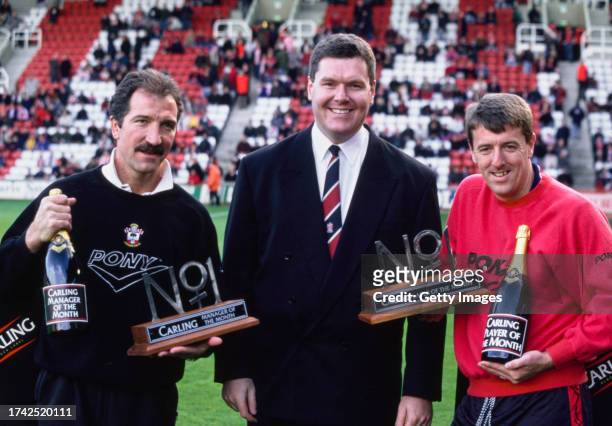 Southampton manager Graeme Souness pictured in his Pony sweatshirt with his bottle of champagne and Manager of the Month award, whilst player Matthew...