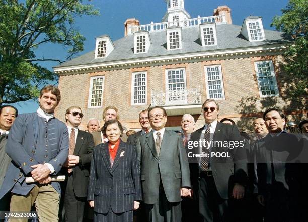 Chinese President Jiang Zemin and wife Wang Ye Ping stand outside the Governors' Palace in Old Williamsburg, Virginia 28 October. President Jiang...