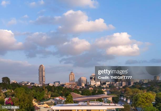 sandton city skyline with the mirage iii jet - sandton cbd stock pictures, royalty-free photos & images