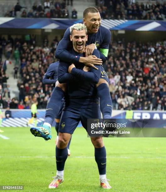 Kylian Mbappe of Team France celebrate his first goal with Antoine Griezmann during the friendly game between France and Scotland at Decathlon Arena...