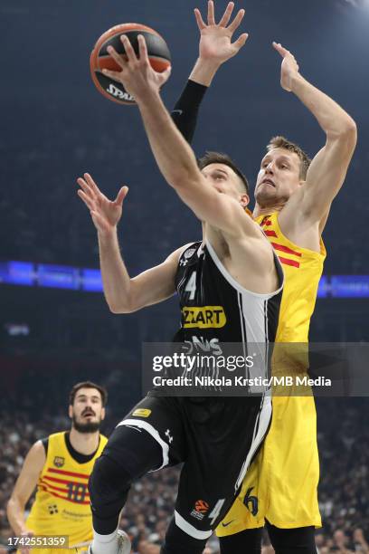 Jan Vesely of FC Barcelona tries to block Aleksa Avramovic of Partizan Mozzart Bet Belgrade during the 2023/2024 Turkish Airlines EuroLeague match...