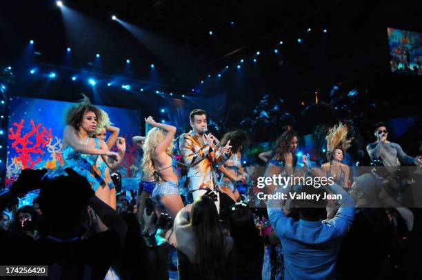 Nacho y Chino performs onstage during the Premios Juventud 2013 at Bank United Center on July 18, 2013 in Miami, Florida.