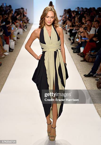 Model walks the runway at the Caitlin Kelly Swimwear show at Cabana Grande at the Raleigh on July 22, 2013 in Miami, Florida.