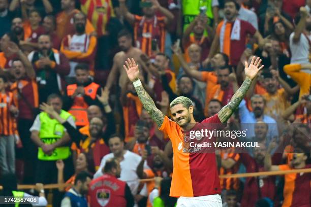 Galatasaray's Argentine forward Mauro Icardi celebrates after scoring a goal during the UEFA Champions League group stage football match between...