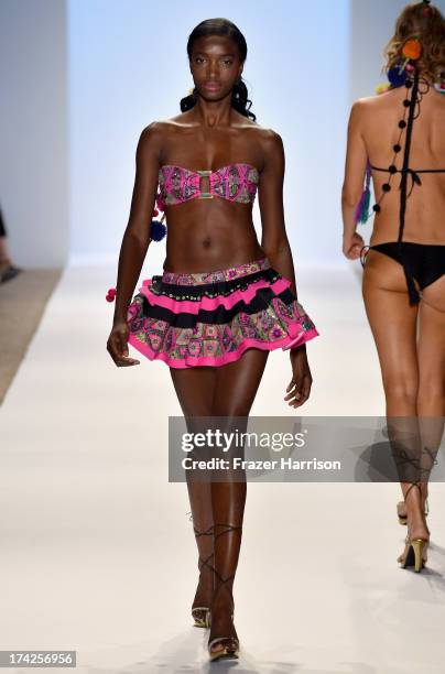 Model walks the runway at the Aguaclara Swimwear show at Cabana Grande at the Raleigh on July 22, 2013 in Miami, Florida.