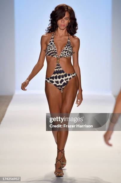 Model walks the runway at the Aguaclara Swimwear show at Cabana Grande at the Raleigh on July 22, 2013 in Miami, Florida.