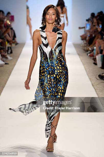 Model walks the runway at the Aguaclara Swimwear show at Cabana Grande at the Raleigh on July 22, 2013 in Miami, Florida.