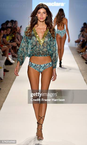 Model walks the runway at the Aguaclara Swimwear show at Cabana Grande at the Raleigh on July 22, 2013 in Miami, Florida.