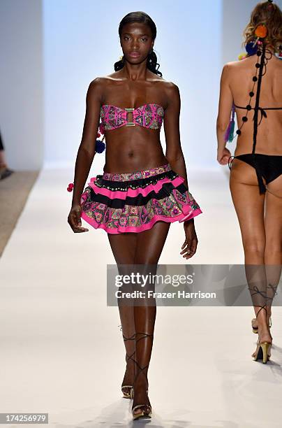 Model walks the runway at the Aguaclara Swimwear show at Cabana Grande at the Raleigh on July 22, 2013 in Miami, Florida.