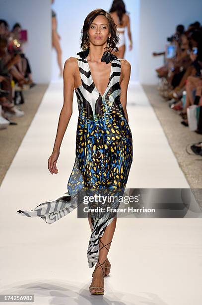 Model walks the runway at the Aguaclara Swimwear show at Cabana Grande at the Raleigh on July 22, 2013 in Miami, Florida.