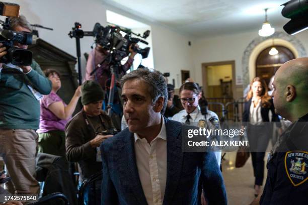 Michael Cohen walks out of the courtroom during a break in his testimony against his former employer and US President, Donald Trump, in New York City...