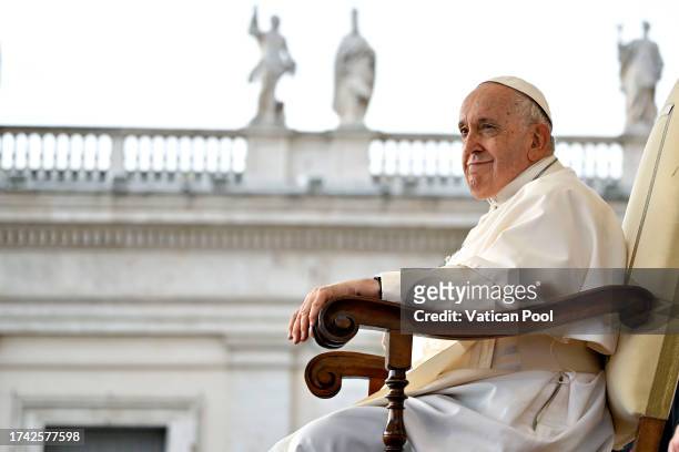 Pope Francis attends his weekly general audience at St. Peter's Square on October 18, 2023 in Vatican City, Vatican. Appealing for peace in the Holy...
