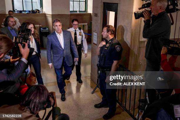 Michael Cohen arrives at the courthouse to testify against his former employer and US President, Donald Trump, in New York City on October 24, 2023....