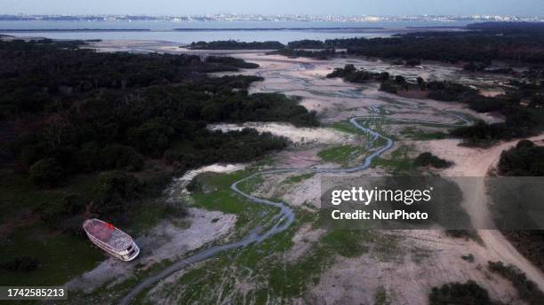 Cacau Pirera , 4th Oct 2023 - Boats and floating houses run aground along the lakes and streams of Cacau Pirera, Amazonas. After the Amazon River...