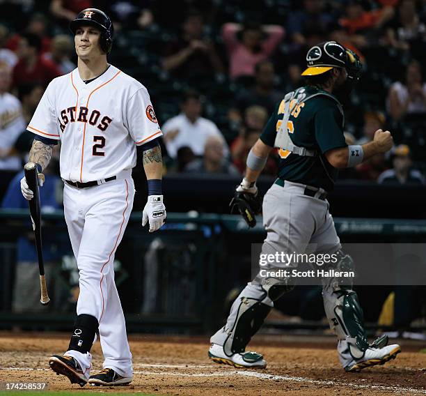 Brandon Barnes of the Houston Astros strikes out to end the game with the Astros losing 4-3 to the Oakland Athletics at Minute Maid Park on July 22,...