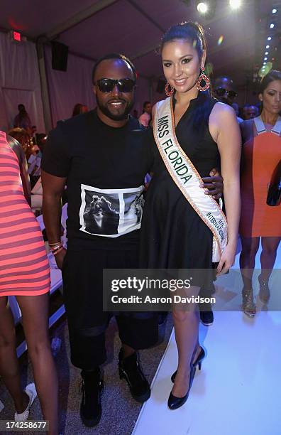 Rico Love and Cassandra Mandevill attend the A.Che Swimwear/Aguaclara Swimwear/Aquarella Swimwear/Caitlin Kelly Swimwear show during Mercedes-Benz...