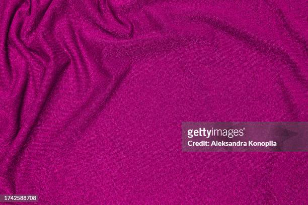 trendy 80s, 90s, 2000s background of draped dark magenta pink, fuchsia fabric with silver lurex thread. beautiful fashionable shiny fabric with a shiny thread for making clothes. textile background texture. - glamour live show fashion shows stock pictures, royalty-free photos & images