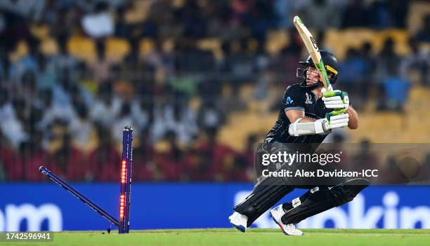 Tom Latham of New Zealand is bowled by Naveen ul Haq of Afghanistan during the ICC Men's Cricket World Cup India 2023 between New Zealand and...