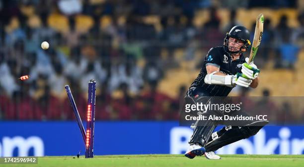 Tom Latham of New Zealand is bowled by Naveen ul Haq of Afghanistan during the ICC Men's Cricket World Cup India 2023 between New Zealand and...