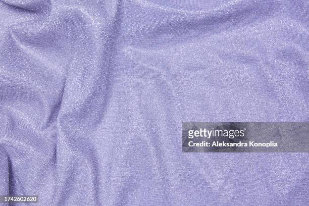 trendy 80s, 90s, 2000s background of draped light purple fabric with silver lurex thread. beautiful fashionable shiny fabric with a shiny thread for making clothes. textile background texture. - glamour live show fashion shows stock pictures, royalty-free photos & images