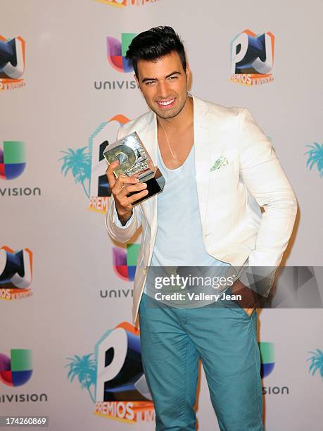 Jencarlos Canela poses in the press room during the Premios Juventud 2013 at Bank United Center on July 18, 2013 in Miami, Florida.