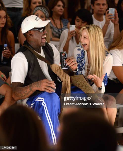 Dennis Rodman and Lisa Pliner attend the Anna Kosturova/Beach Riot/Lolli Swim/Manglar/Indah show during Mercedes-Benz Fashion Week Swim 2014 at the...