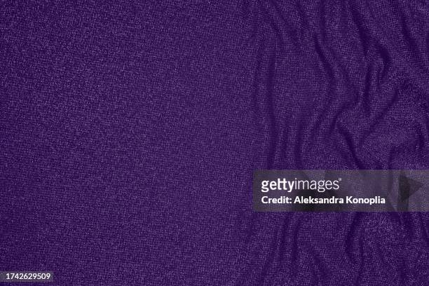 trendy 80s, 90s, 2000s background of draped dark saturated purple fabric with silver lurex thread. beautiful fashionable shiny fabric with a shiny thread for making clothes. textile background texture. - glamour live show fashion shows stock pictures, royalty-free photos & images