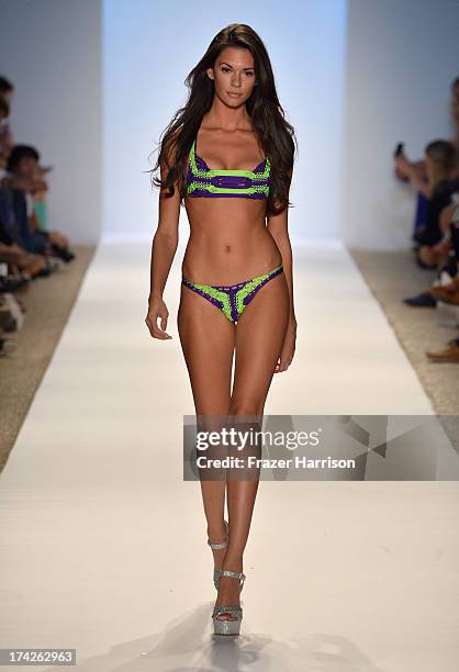 Model walks the runway at the Indah show during Mercedes-Benz Fashion Week Swim 2014 at the Raleigh on July 22, 2013 in Miami Beach, Florida.