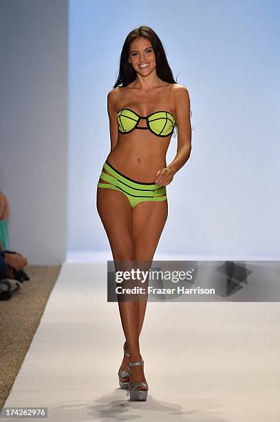 Model walks the runway at the Indah show during Mercedes-Benz Fashion Week Swim 2014 at the Raleigh on July 22, 2013 in Miami Beach, Florida.