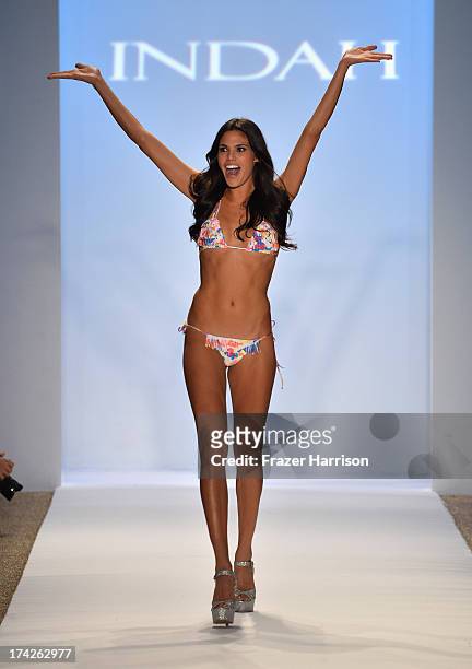 Model walks the runway at the Indah show during Mercedes-Benz Fashion Week Swim 2014 at the Raleigh on July 22, 2013 in Miami Beach, Florida.