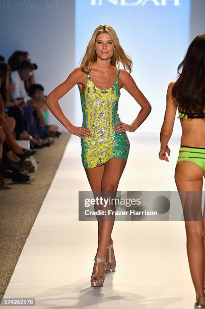 Model walks the runway at the Indah show during Mercedes-Benz Fashion Week Swim 2014 at the Raleigh on July 22, 2013 in Miami Beach, Florida.