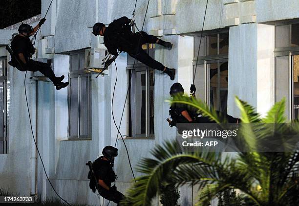 Members of the Algerian police forces take part in a show of force ceremony marking the fiftieth anniversary of the General Directorate of National...