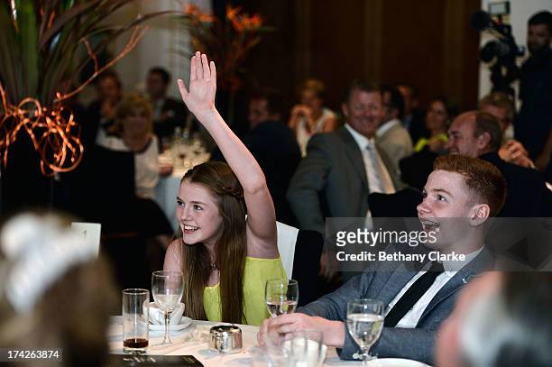 Ronan Keating's children, Marie Keating and Jack Keating bid in the charity auction during the Gary Player Invitational Europe 2013 Gala Dinner at...